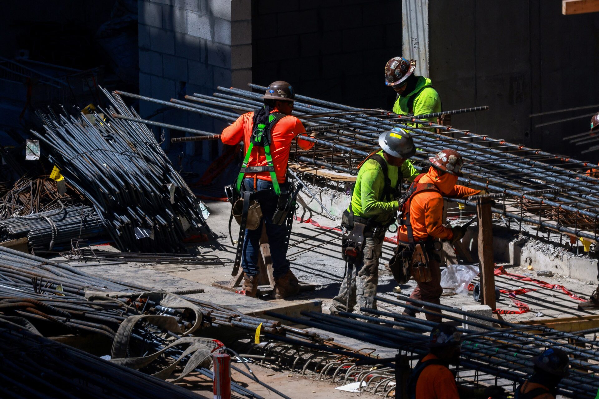 Workers install steel rods at a construction site in Miami, Florida Reuters